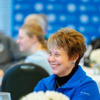 woman smiles during brunch panel